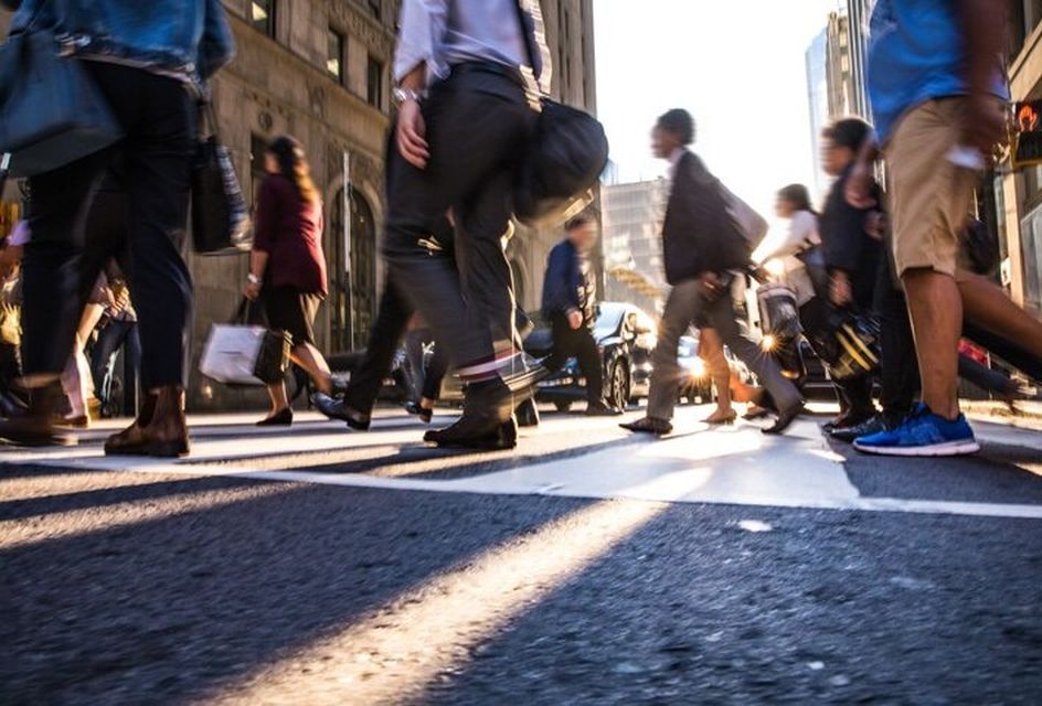 People walking across a pedestrian crossing