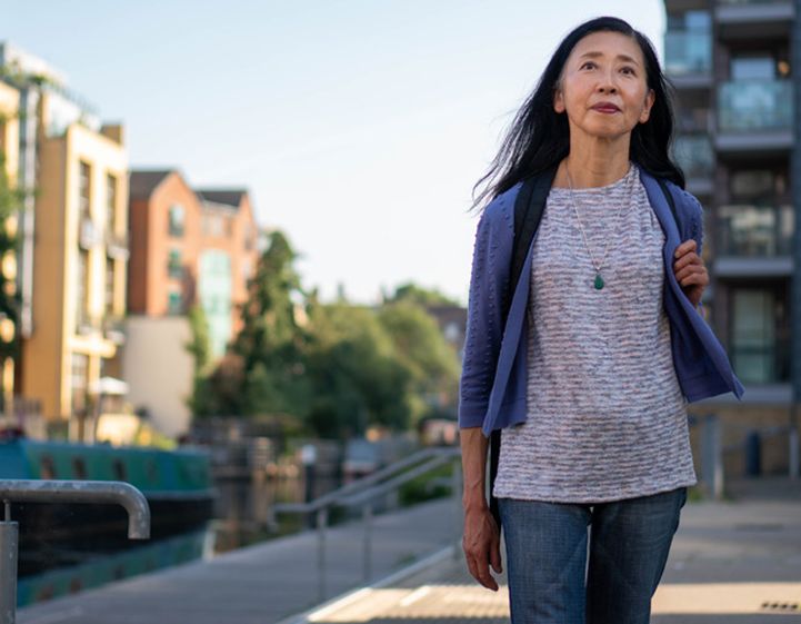 Woman walking along the street
