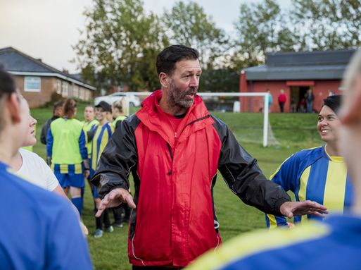 Male local football coach encouraging his team - RSPH accociate member