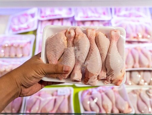 A packet of raw chicken drumsticks.
