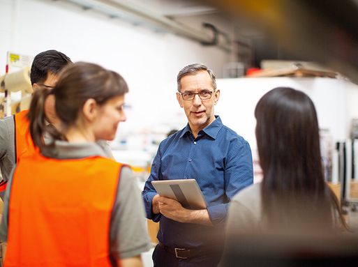 A manager instructing staff about health and safety
